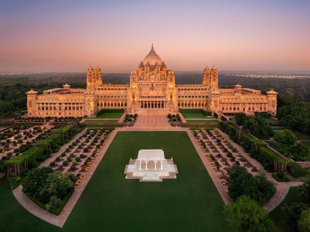 Panoramic view of Umaid Bhawan Palace and lush royal gardens at sunset in Jodhpur